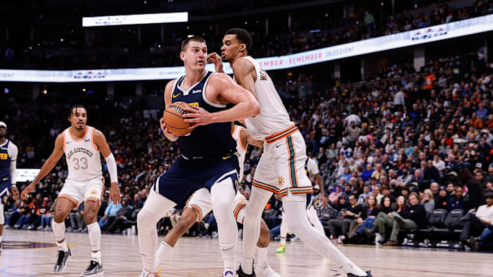 Nov 26, 2023; Denver, Colorado, USA; Denver Nuggets center Nikola Jokic (15) controls the ball as