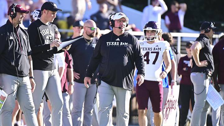 Texas A&M Aggies head coach Mike Elko walks down the sideline during the first half against the Mississippi State Bulldogs at Davis Wade Stadium at Scott Field. Texas A&M Aggies head coach Mike Elko walks down the sideline during the first half against the Mississippi State Bulldogs at Davis Wade Stadium at Scott Field.