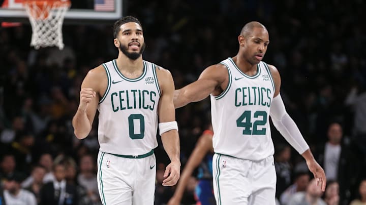 Nov 4, 2023; Brooklyn, New York, USA;  Boston Celtics forward Jayson Tatum (0) and center Al Horford (42) walk back to the bench after the Brooklyn Nets call a time out in the fourth quarter at Barclays Center. Mandatory Credit: Wendell Cruz-Imagn Images