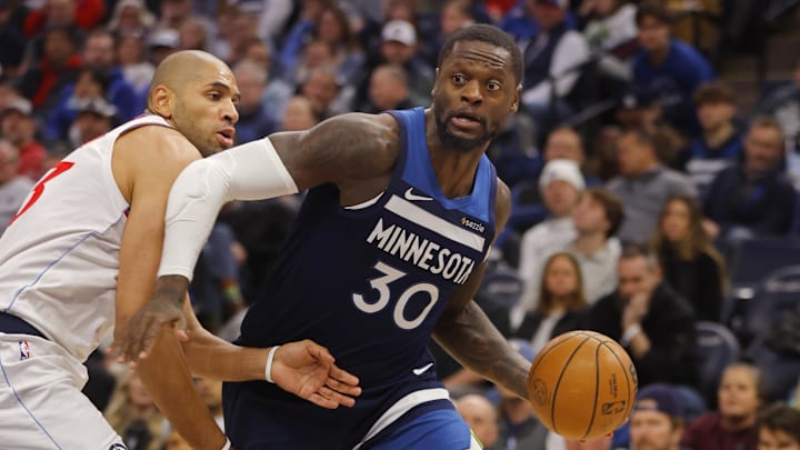 Jan 6, 2025; Minneapolis, Minnesota, USA; Minnesota Timberwolves forward Julius Randle (30) works around Los Angeles Clippers forward Nicolas Batum (33) in the second quarter at Target Center. Mandatory Credit: Bruce Kluckhohn-Imagn Images
