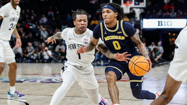 Michigan guard Dug McDaniel (0) dribbles against p1 during the first half of the First Round of Big Ten tournament at Target Center in Minneapolis, Minn. on Wednesday, March 13, 2024.