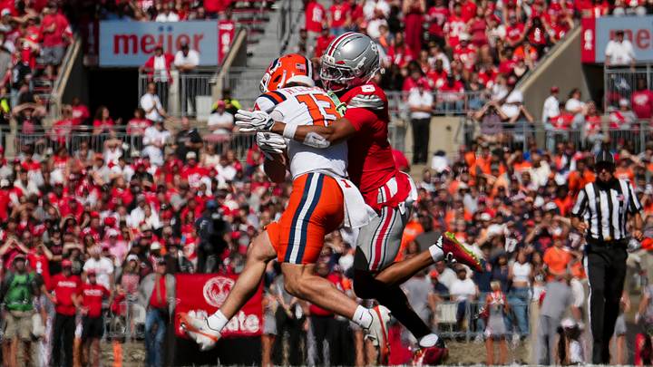 Ohio State Buckeyes linebacker Riley Pettijohn (5) tackles Illinois Fighting Illini wide receiver Hudson Clement (13) during the NCAA football game at Ohio Stadium in Columbus on Sept. 26, 2026.