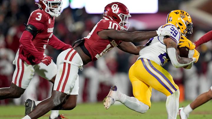 Oklahoma Sooners linebacker Kip Lewis (10) chases after Louisiana State Tigers running back Caden Durham (29) during a college football game between the University of Oklahoma Sooners (OU) and the LSU Tigers at Gaylord Family – Oklahoma Memorial Stadium in Norman, Okla., Saturday, Nov. 29, 2025. Oklahoma won 17-13. Oklahoma Sooners linebacker Kip Lewis (10) chases after Louisiana State Tigers running back Caden Durham (29) during a college football game between the University of Oklahoma Sooners (OU) and the LSU Tigers at Gaylord Family – Oklahoma Memorial Stadium in Norman, Okla., Saturday, Nov. 29, 2025. Oklahoma won 17-13.