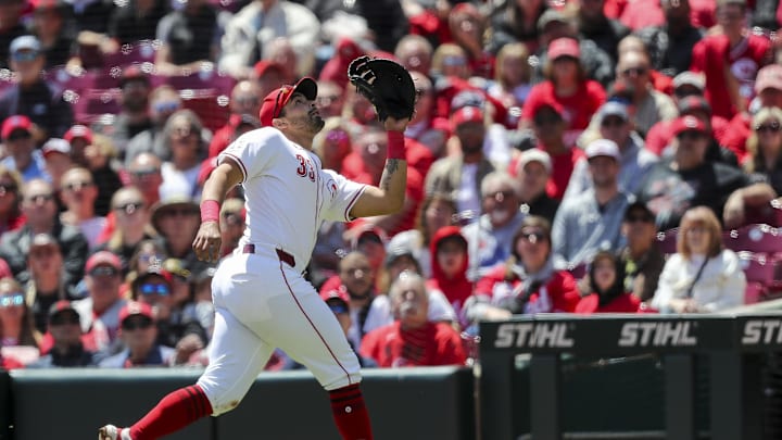 Apr 25, 2024; Cincinnati, Ohio, USA; Cincinnati Reds first baseman Christian Encarnacion-Strand (33) catches a pop up hit by Philadelphia Phillies third baseman Alec Bohm (not pictured) in the second inning at Great American Ball Park. Mandatory Credit: Katie Stratman-Imagn Images
