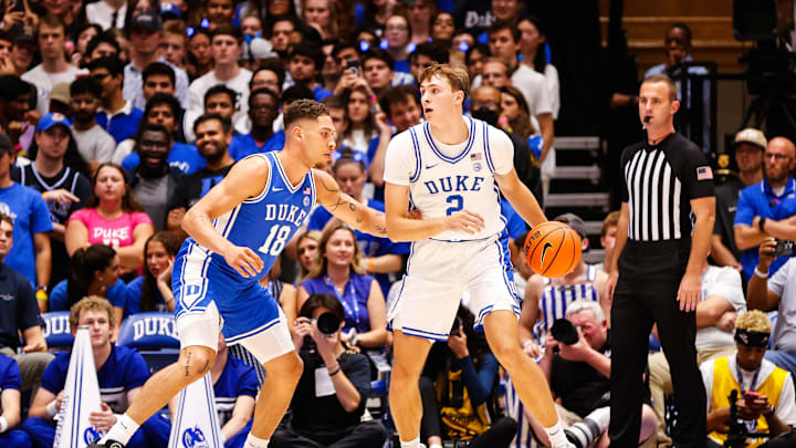 Oct 4, 2024; Durham, NC, USA; Duke Blue Devils guard Cooper Flagg (2) dribbles the ball against forward Mason Gillis (18) with the ball during Countdown to Craziness at Cameron Indoor Stadium. Mandatory Credit: Jaylynn Nash-Imagn Images