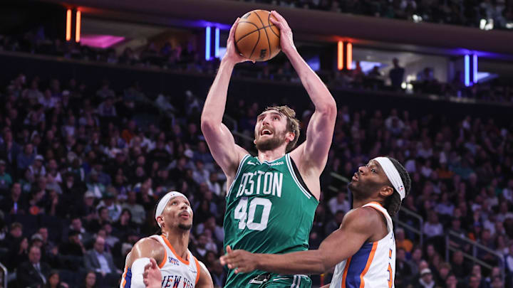 Feb 8, 2025; New York, New York, USA;  Boston Celtics center Luke Kornet (40) drives past New York Knicks guard Josh Hart (3) and forward Precious Achiuwa (5) in the fourth quarter at Madison Square Garden. Mandatory Credit: Wendell Cruz-Imagn Images