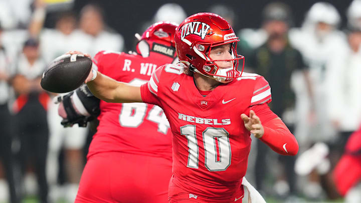 Nov 21, 2025; Paradise, Nevada, USA; UNLV Rebels quarterback Anthony Colandrea (10) looks to throw against the Hawaii Rainbow Warriors during the second quarter at Allegiant Stadium. Mandatory Credit: Stephen R. Sylvanie-Imagn Images