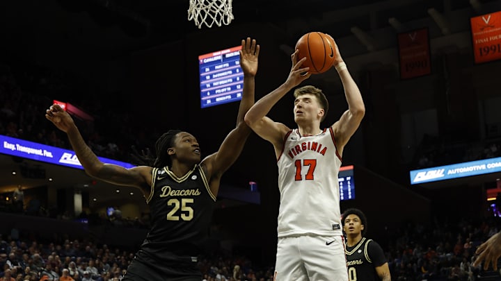 Mar 3, 2026; Charlottesville, Virginia, USA; Virginia Cavaliers center Johann Grünloh (17) is fouled while scoring by Wake Forest Demon Deacons forward Tre'von Spillers (25) in the second half at John Paul Jones Arena. Mandatory Credit: Geoff Burke-Imagn Images Mar 3, 2026; Charlottesville, Virginia, USA; Virginia Cavaliers center Johann Grünloh (17) is fouled while scoring by Wake Forest Demon Deacons forward Tre'von Spillers (25) in the second half at John Paul Jones Arena. Mandatory Credit: Geoff Burke-Imagn Images