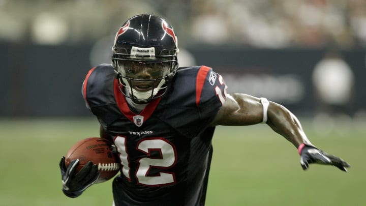 August 20, 2011; Houston, TX, USA; Houston Texans wide receiver  Jacoby Jones (12) attempts to get additional yardage after a second half reception against the New Orleans Saints at Reliant Stadium. Mandatory Credit: Troy Taormina-USA TODAY Sports