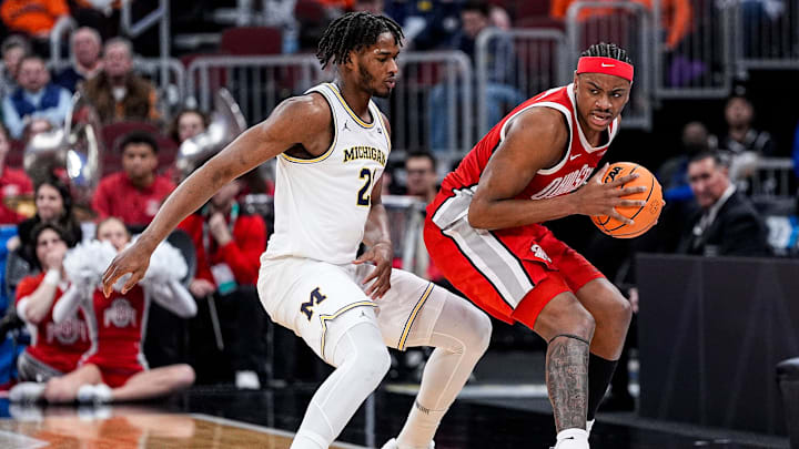 Michigan forward Morez Johnson Jr. (21) defends Ohio State forward Amare Bynum (1) during the second half of Big Ten tournament quarterfinal at United Center in Chicago on Friday, March 13, 2026.