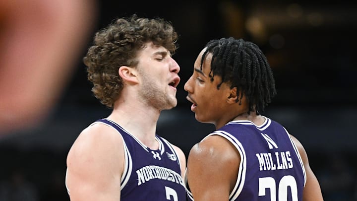 Mar 12, 2025; Indianapolis, IN, USA; Northwestern Wildcats forward Nick Martinelli (2) and Northwestern Wildcats guard Justin Mullins (20) celebrate after a play during the second half against the Minnesota Golden Gophers at Gainbridge Fieldhouse. Mandatory Credit: Robert Goddin-Imagn Images