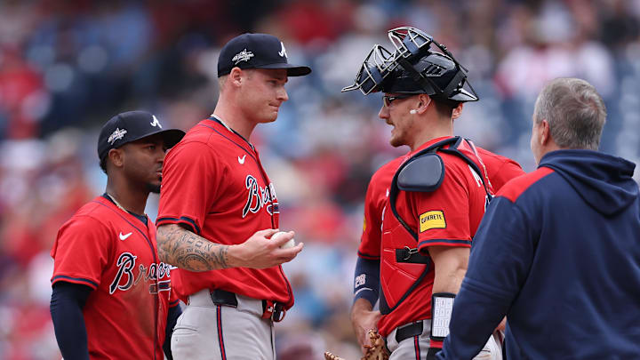 May 29, 2025; Philadelphia, Pennsylvania, USA; Atlanta Braves pitcher AJ Smith-Shawver (32) talks with catcher Sean Murphy (12) before leaving the game during the third inning against the Philadelphia Phillies at Citizens Bank Park. Mandatory Credit: Bill Streicher-Imagn Images