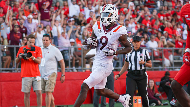 Sep 16, 2023; Piscataway, New Jersey, USA; Virginia Tech Hokies wide receiver Da'Quan Felton (9) scores on a pass reception during the second half against the Rutgers Scarlet Knights at SHI Stadium. Mandatory Credit: Vincent Carchietta-Imagn Images