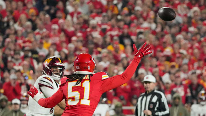 Oct 27, 2025; Kansas City, Missouri, USA; Kansas City Chiefs defensive end Michael Danna (51) intercepts a pass from Washington Commanders quarterback Marcus Mariota (8) during the first quarter of the game at GEHA Field at Arrowhead Stadium. Mandatory Credit: Denny Medley-Imagn Images