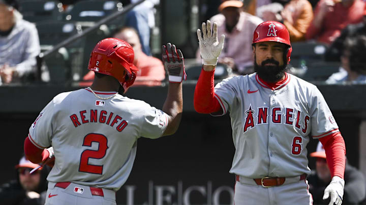 Mar 31, 2024; Baltimore, Maryland, USA;  Los Angeles Angels second baseman Luis Rengifo (2) celebrates with third baseman Anthony Rendon (6) after scoring  during the second inning against the Baltimore Orioles at Oriole Park at Camden Yards. Mandatory Credit: Tommy Gilligan-Imagn Images