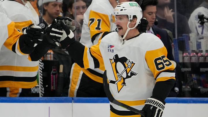 Nov 3, 2025; Toronto, Ontario, CAN; Pittsburgh Penguins defenseman Erik Karlsson (65) is congratulated after scoring against the Toronto Maple Leafs during the first period at Scotiabank Arena. Mandatory Credit: John E. Sokolowski-Imagn Images