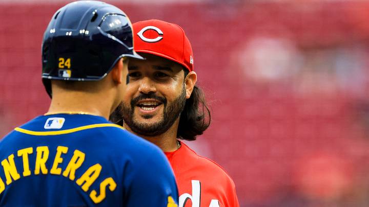 Jun 22, 2026; Cincinnati, Ohio, USA; Cincinnati Reds third baseman Eugenio Suarez (28) talks with Milwaukee Brewers catcher William Contreras (24) during a stop in play in the second inning at Great American Ball Park. Mandatory Credit: Katie Stratman-Imagn Images
