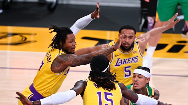 Apr 19, 2021; Los Angeles, California, USA; Utah Jazz guard Jordan Clarkson (00) is defended by Los Angeles Lakers guard Wesley Matthews (9) center Montrezl Harrell (15) guard Ben McLemore (7) and guard Talen Horton-Tucker (5) during the second quarter at Staples Center. Mandatory Credit: Robert Hanashiro-Imagn Images Apr 19, 2021; Los Angeles, California, USA; Utah Jazz guard Jordan Clarkson (00) is defended by Los Angeles Lakers guard Wesley Matthews (9) center Montrezl Harrell (15) guard Ben McLemore (7) and guard Talen Horton-Tucker (5) during the second quarter at Staples Center. Mandatory Credit: Robert Hanashiro-Imagn Images