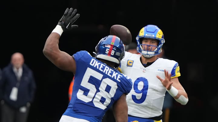 East Rutherford, NJ     December 31, 2023 -- Bobby Okereke of the Giants pressures Rams quarterback Matthew Stafford in the first half.  