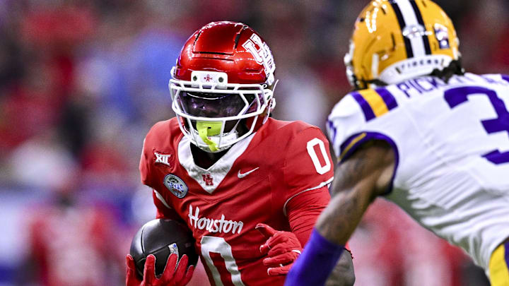 Dec 27, 2025; Houston, TX, USA; Houston Cougars wide receiver Amare Thomas (0) runs the ball during the first half against the Louisiana State Tigers at NRG Stadium. Mandatory Credit: Maria Lysaker-Imagn Images 
