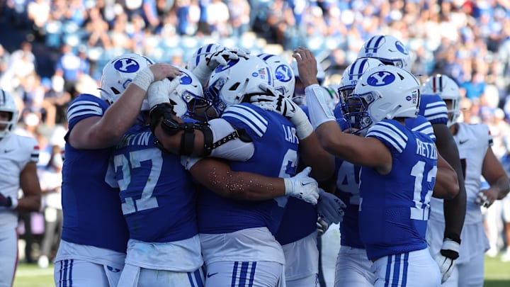 The entire BYU offense celebrates with LJ Martin in the endzone against Arizona.