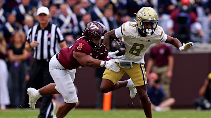Oct 26, 2024; Blacksburg, Virginia, USA; Georgia Tech Yellow Jackets wide receiver Malik Rutherford (8) runs the ball against Virginia Tech Hokies linebacker Sam Brumfield (3) during the third quarter at Lane Stadium. Mandatory Credit: Peter Casey-Imagn Images Oct 26, 2024; Blacksburg, Virginia, USA; Georgia Tech Yellow Jackets wide receiver Malik Rutherford (8) runs the ball against Virginia Tech Hokies linebacker Sam Brumfield (3) during the third quarter at Lane Stadium. Mandatory Credit: Peter Casey-Imagn Images