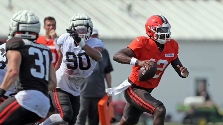 Browns quarterback Shedeur Sanders runs for a short gain during training camp, July 30, 2025, in Berea.