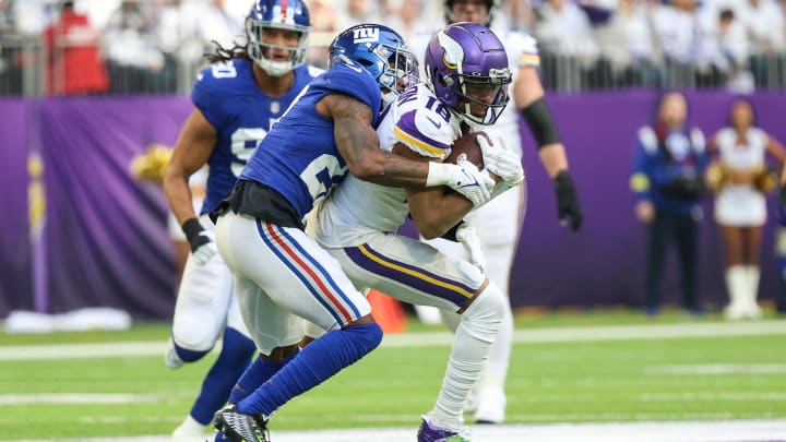 Dec 24, 2022; Minneapolis, Minnesota, USA; Minnesota Vikings wide receiver Justin Jefferson (18) makes a catch against the New York Giants during the first quarter at U.S. Bank Stadium. Dec 24, 2022; Minneapolis, Minnesota, USA; Minnesota Vikings wide receiver Justin Jefferson (18) makes a catch against the New York Giants during the first quarter at U.S. Bank Stadium.