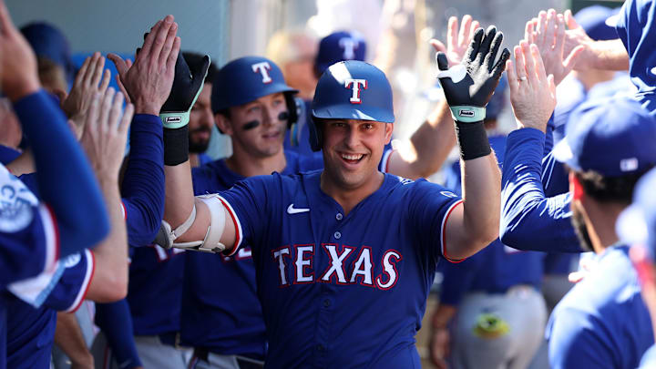 Sep 29, 2024; Anaheim, California, USA;  Texas Rangers first baseman Nathaniel Lowe (30) celebrates in the dugout after hitting a home run during the eighth inning against the Los Angeles Angels at Angel Stadium. 