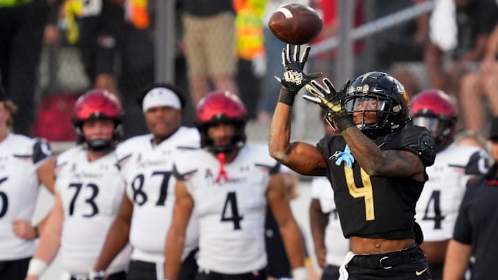 UCF Knights wide receiver Ryan O'Keefe (4) eyes a pass but is unable to complete the catch in the third quarter during a college football game against the Cincinnati Bearcats, Saturday, Oct. 29, 2022, at FBC Mortgage Stadium in Orlando, Fla. The UCF Knights defeated the Cincinnati Bearcats, 25-21.