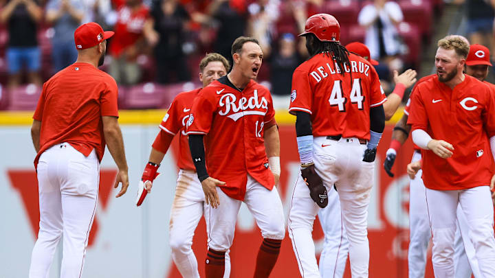 Aug 17, 2025; Cincinnati, Ohio, USA; Cincinnati Reds designated hitter Austin Hays (12) celebrates with teammates after hitting a walk-off single in the tenth inning against the Milwaukee Brewers at Great American Ball Park. Mandatory Credit: Katie Stratman-Imagn Images Aug 17, 2025; Cincinnati, Ohio, USA; Cincinnati Reds designated hitter Austin Hays (12) celebrates with teammates after hitting a walk-off single in the tenth inning against the Milwaukee Brewers at Great American Ball Park. Mandatory Credit: Katie Stratman-Imagn Images