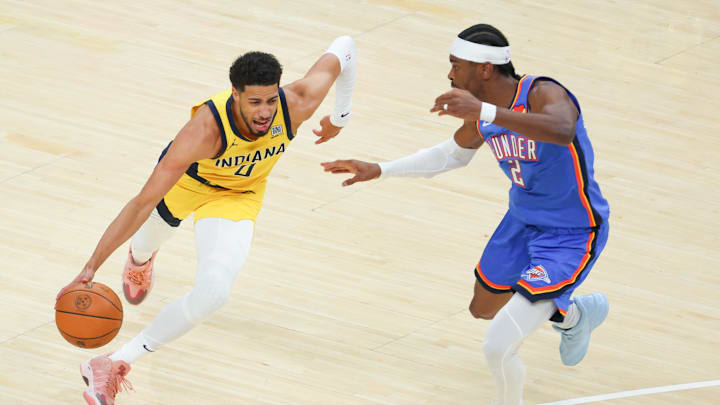 Jun 19, 2025; Indianapolis, Indiana, USA; Indiana Pacers guard Tyrese Haliburton (0) drives to the basket against Oklahoma City Thunder guard Shai Gilgeous-Alexander (2) in the first quarter during game six of the 2025 NBA Finals at Gainbridge Fieldhouse. Mandatory Credit: Trevor Ruszkowski-Imagn Images