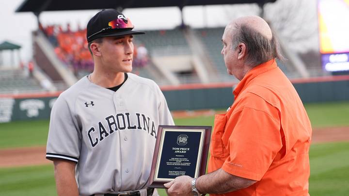 South Carolina junior Josh Gunther (24) is presented the Tom Price Award by Bob Bradley for being the top SC player in the series with Clemson, after the game at Doug Kingsmore Stadium in Clemson, S.C. Sunday, March 1, 2026. Clemson won the game 7-2 and the series with state rival University of South Carolina 2-1.