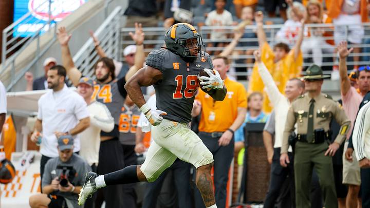 Oct 3, 2026; Knoxville, Tennessee, USA;  Tennessee Volunteers running back DeSean Bishop (18) runs for a touchdown against the Auburn Tigers during the second half at Neyland Stadium.  Mandatory Credit: Randy Sartin-Imagn Images