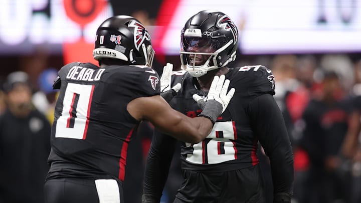 Sep 7, 2025; Atlanta, Georgia, USA; Atlanta Falcons linebacker Divine Deablo (0) and defensive tackle David Onyemata (90) react after a play against the Tampa Bay Buccaneers during the second quarter at Mercedes-Benz Stadium. Mandatory Credit: Brett Davis-Imagn Images
