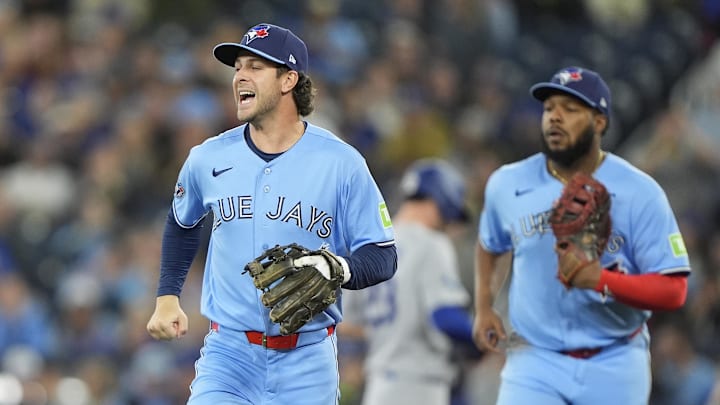 Apr 8, 2026; Toronto, Ontario, CAN; Toronto Blue Jays second baseman Ernie Clement (22) reacts after getting Los Angeles Dodgers first baseman Freddie Freeman (not pictured) on a line drive during the first inning at Rogers Centre. Mandatory Credit: John E. Sokolowski-Imagn Images