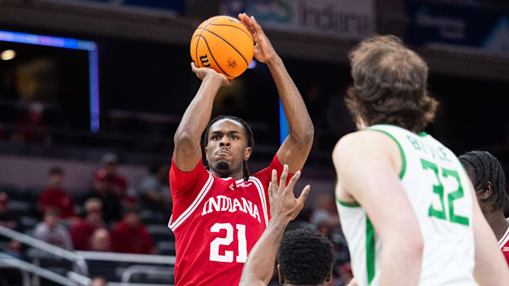 Mar 13, 2025; Indianapolis, IN, USA; Indiana Hoosiers forward Mackenzie Mgbako (21) shoots the ball while Oregon Ducks guard TJ Bamba (5) defends in the first half at Gainbridge Fieldhouse. Mandatory Credit: Trevor Ruszkowski-Imagn Images Mar 13, 2025; Indianapolis, IN, USA; Indiana Hoosiers forward Mackenzie Mgbako (21) shoots the ball while Oregon Ducks guard TJ Bamba (5) defends in the first half at Gainbridge Fieldhouse. Mandatory Credit: Trevor Ruszkowski-Imagn Images