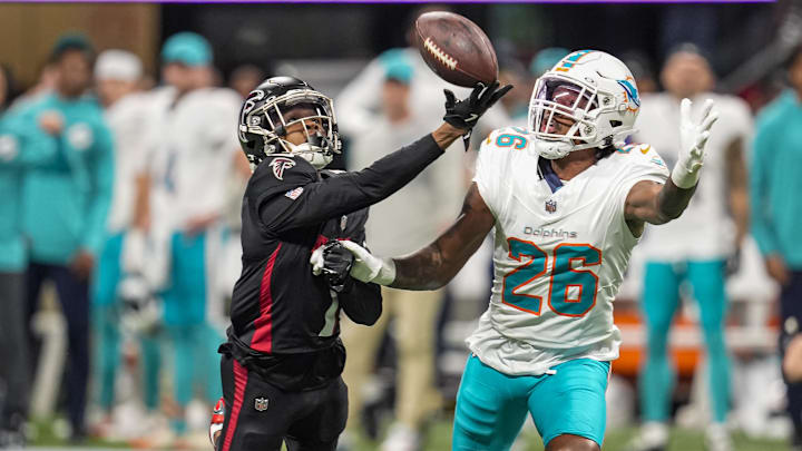 Miami Dolphins cornerback Rasul Douglas (26) is called for pass interference while defending Atlanta Falcons wide receiver Darnell Mooney (1) during the second half at Mercedes-Benz Stadium. 