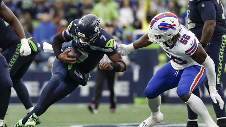 Oct 27, 2024; Seattle, Washington, USA; Buffalo Bills defensive end Javon Solomon (56) sacks Seattle Seahawks quarterback Geno Smith (7) during the fourth quarter at Lumen Field. Mandatory Credit: Joe Nicholson-Imagn Images Oct 27, 2024; Seattle, Washington, USA; Buffalo Bills defensive end Javon Solomon (56) sacks Seattle Seahawks quarterback Geno Smith (7) during the fourth quarter at Lumen Field. Mandatory Credit: Joe Nicholson-Imagn Images
