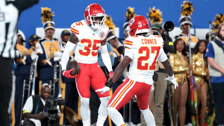 Sep 21, 2025; East Rutherford, New Jersey, USA; Kansas City Chiefs cornerback Jaylen Watson (35) celebrates with defensive back Chamarri Conner (27) after an interception in the second quarter at MetLife Stadium. Mandatory Credit: Vincent Carchietta-Imagn Images
