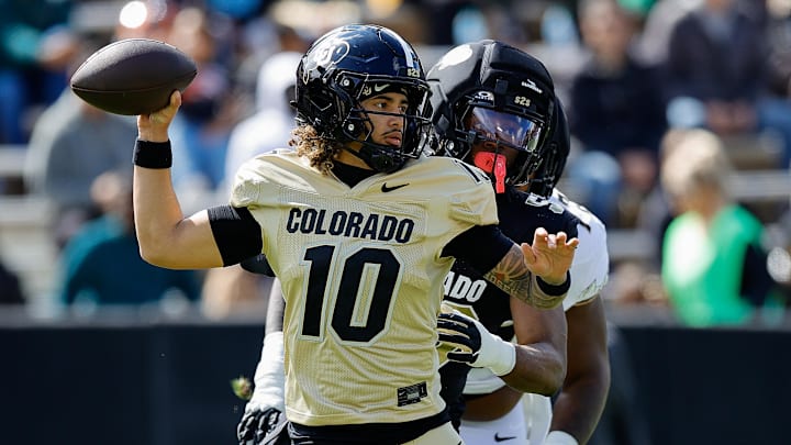 Apr 19, 2025; Boulder, CO, USA; Colorado Buffaloes quarterback Julian Lewis (10) and defensive end Arden Walker (53) during the spring game at Folsom Field. Mandatory Credit: Isaiah J. Downing-Imagn Images