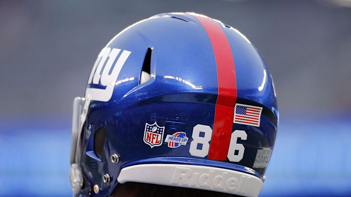 General view of New York Giants helmet displaying the Heads Up football logo.