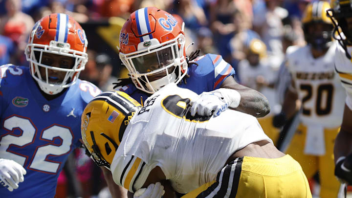 Oct 8, 2022; Gainesville, Florida, USA;Florida Gators safety Kamari Wilson (5) tackles Missouri Tigers running back Nathaniel Peat (8)  during the second quarter at Ben Hill Griffin Stadium. Mandatory Credit: Kim Klement-Imagn Images