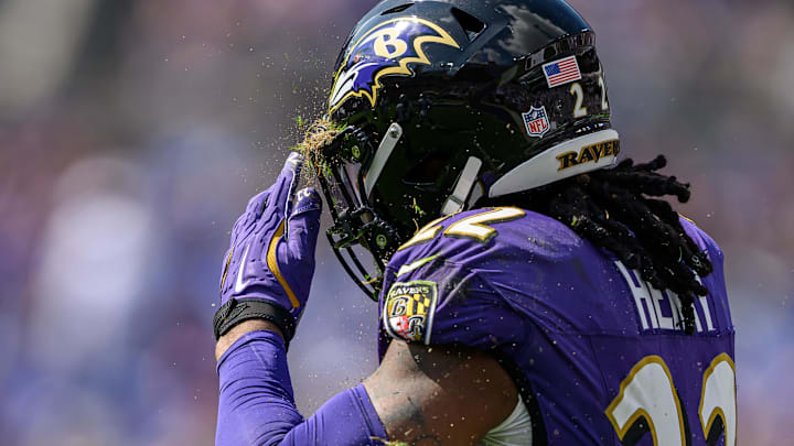 Sep 15, 2024; Baltimore, Maryland, USA; Baltimore Ravens running back Derrick Henry (22) removes grass from his helmet during the second half against the Las Vegas Raiders at M&T Bank Stadium. Mandatory Credit: Reggie Hildred-Imagn Images