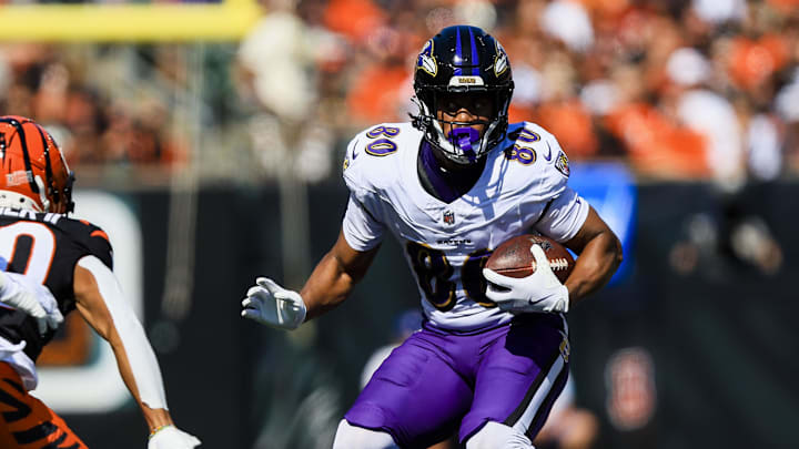Oct 6, 2024; Cincinnati, Ohio, USA; Baltimore Ravens tight end Isaiah Likely (80) runs with the ball against the Cincinnati Bengals in the first half at Paycor Stadium. Mandatory Credit: Katie Stratman-Imagn Images