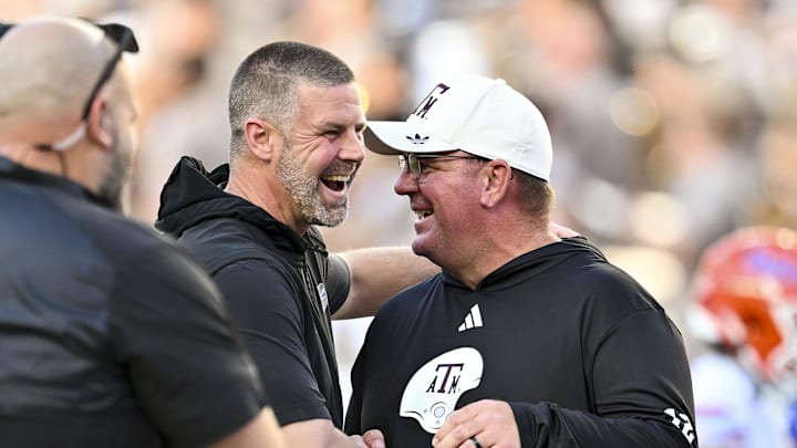 Texas A&M Aggies head coach Mike Elko, right, greet prior to the game at Kyle Field. 