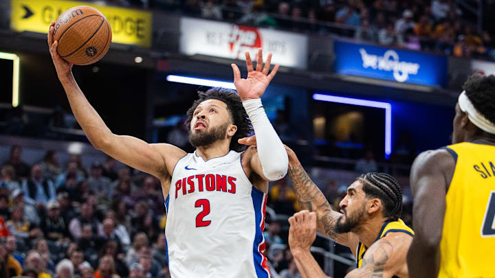 Nov 29, 2024; Indianapolis, Indiana, USA; Detroit Pistons guard Cade Cunningham (2) shoots the ball while Indiana Pacers forward Obi Toppin (1) defends in the second half  at Gainbridge Fieldhouse. Mandatory Credit: Trevor Ruszkowski-Imagn Images