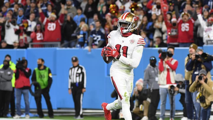 Dec 23, 2021; Nashville, Tennessee, USA; San Francisco 49ers wide receiver Brandon Aiyuk (11) catches a touchdown pass during the second half against the Tennessee Titans at Nissan Stadium. Mandatory Credit: Christopher Hanewinckel-USA TODAY Sports