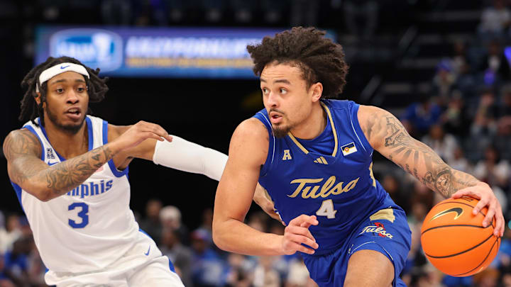Feb 5, 2025; Memphis, Tennessee, USA; Tulsa Golden Hurricane guard Braeden Carrington (4) drives to the basket against Memphis Tigers guard Colby Rogers (3) during the second half at FedExForum. Mandatory Credit: Wesley Hale-Imagn Images Feb 5, 2025; Memphis, Tennessee, USA; Tulsa Golden Hurricane guard Braeden Carrington (4) drives to the basket against Memphis Tigers guard Colby Rogers (3) during the second half at FedExForum. Mandatory Credit: Wesley Hale-Imagn Images