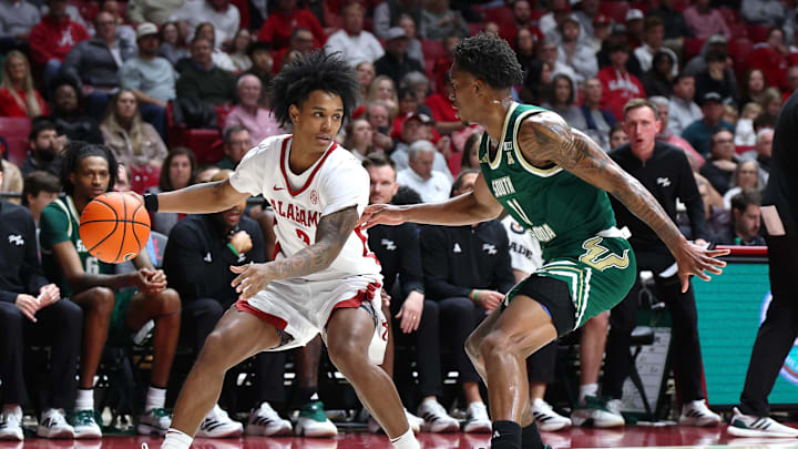 Dec 17, 2025; Tuscaloosa, Alabama, USA; Alabama Crimson Tide guard Aden Holloway (2) dribbles against South Florida Bulls guard CJ Brown (11) during the first half at Coleman Coliseum. Mandatory Credit: David Leong-Imagn Images Dec 17, 2025; Tuscaloosa, Alabama, USA; Alabama Crimson Tide guard Aden Holloway (2) dribbles against South Florida Bulls guard CJ Brown (11) during the first half at Coleman Coliseum. Mandatory Credit: David Leong-Imagn Images